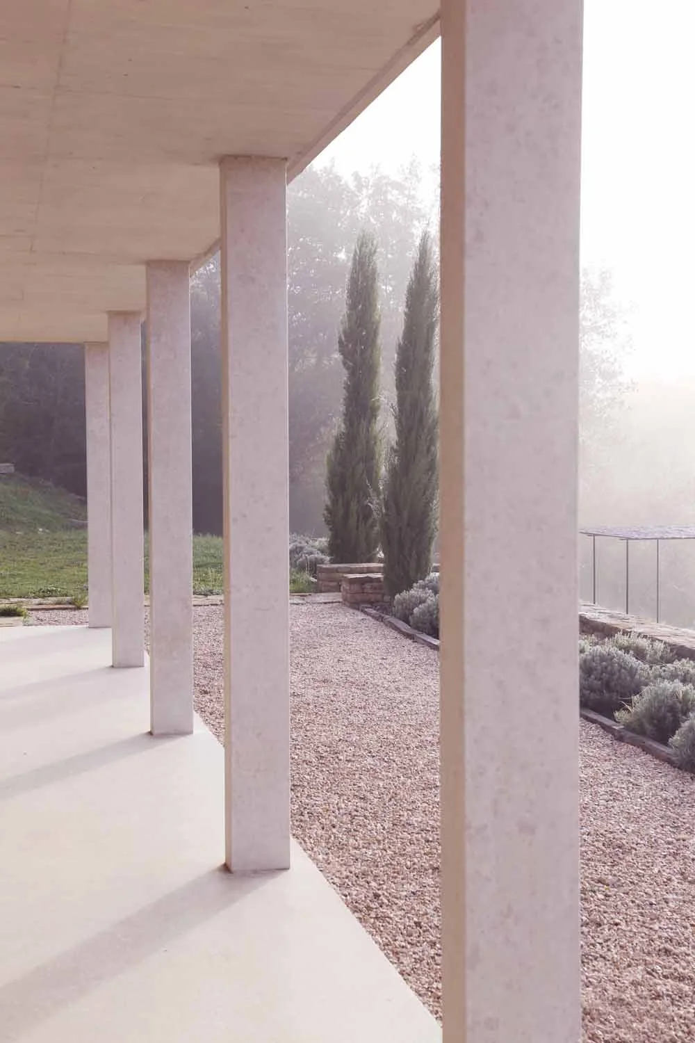 Colonnaded garden facade with climbing plants