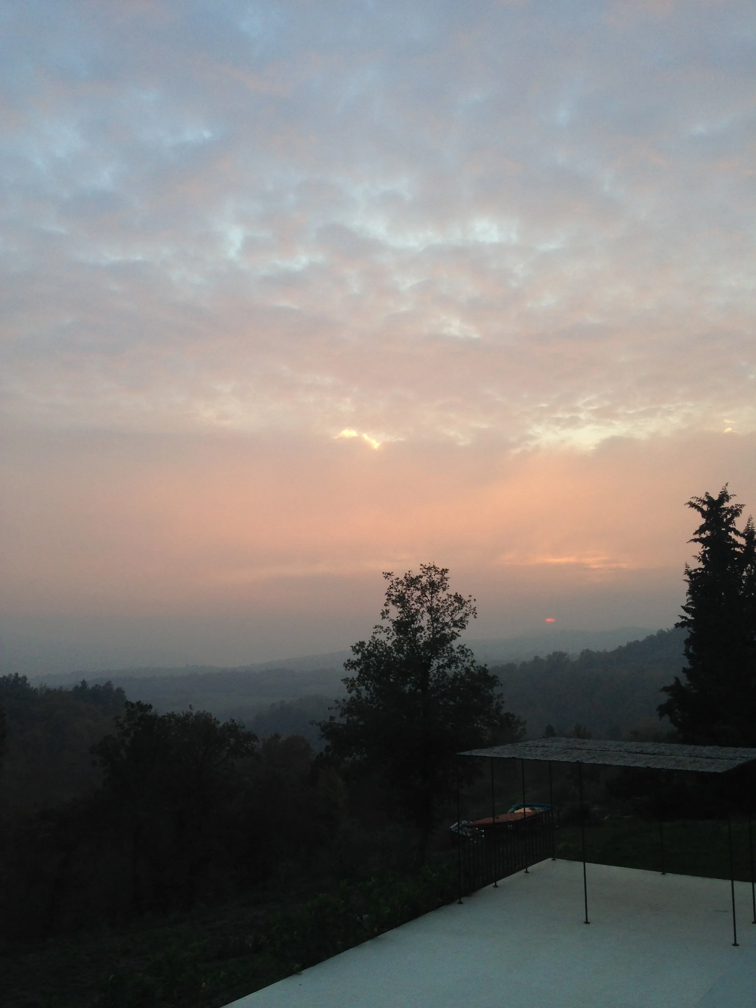 Pool pergola glowing at evening sunset