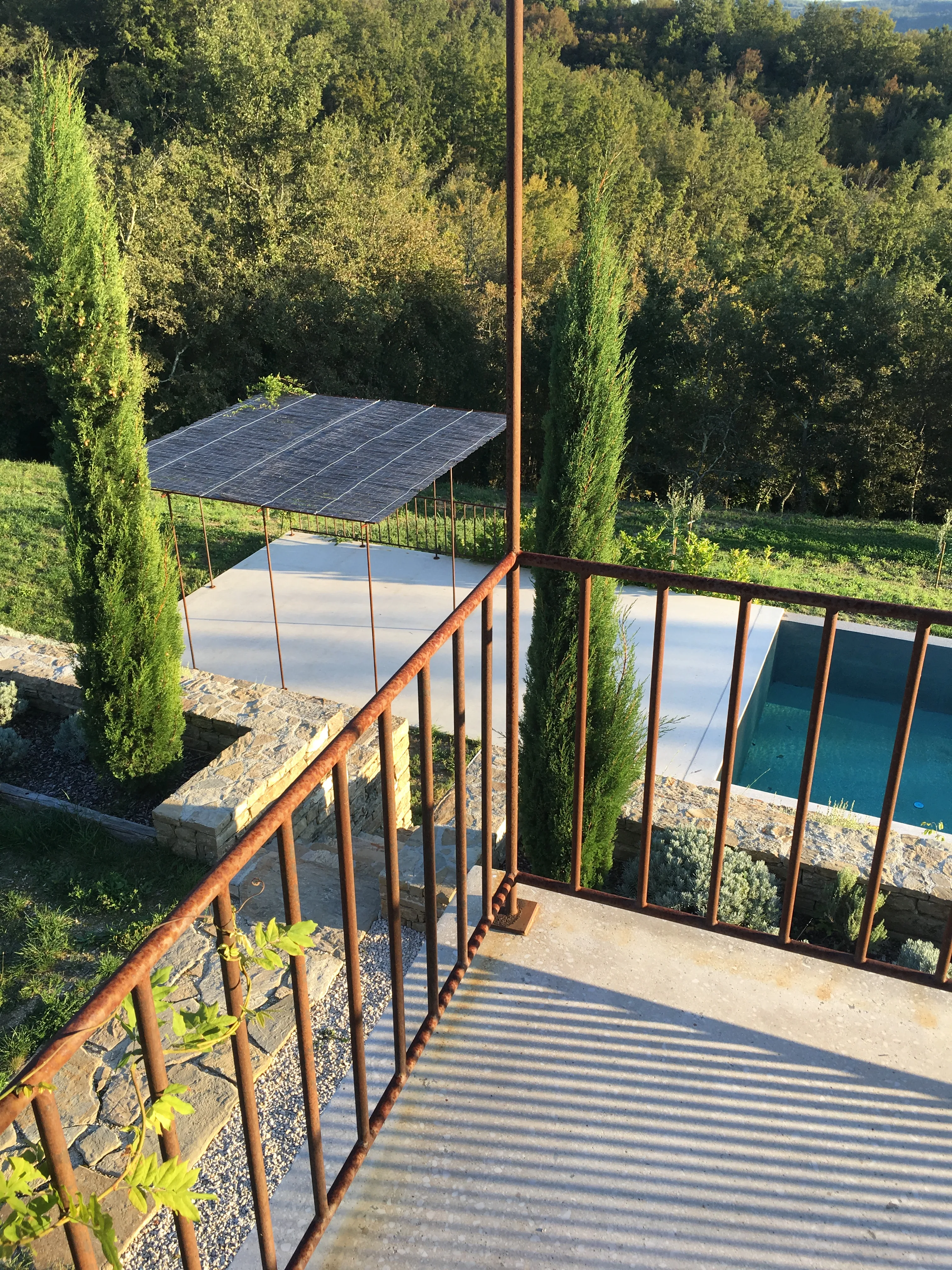 View onto the pool from the upper terrace