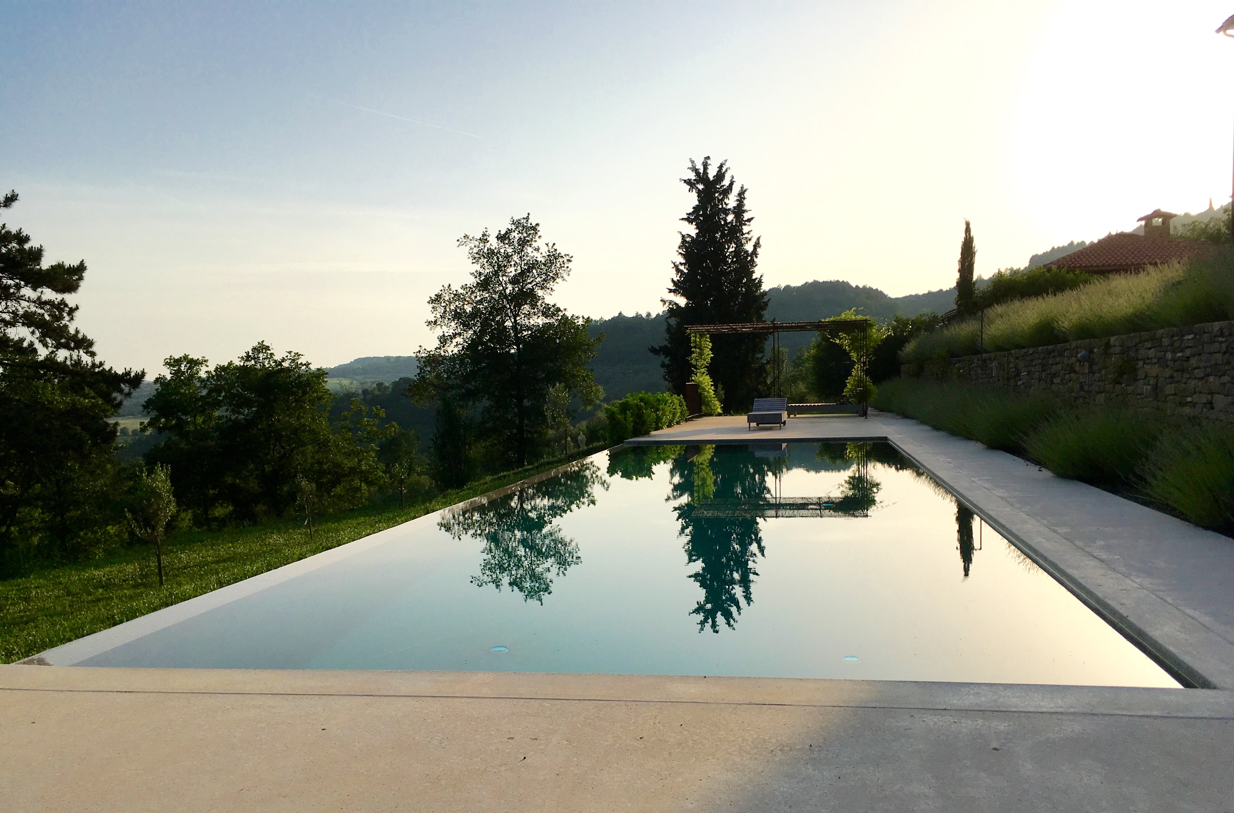 Swimming pool with sun terrace and valley views
