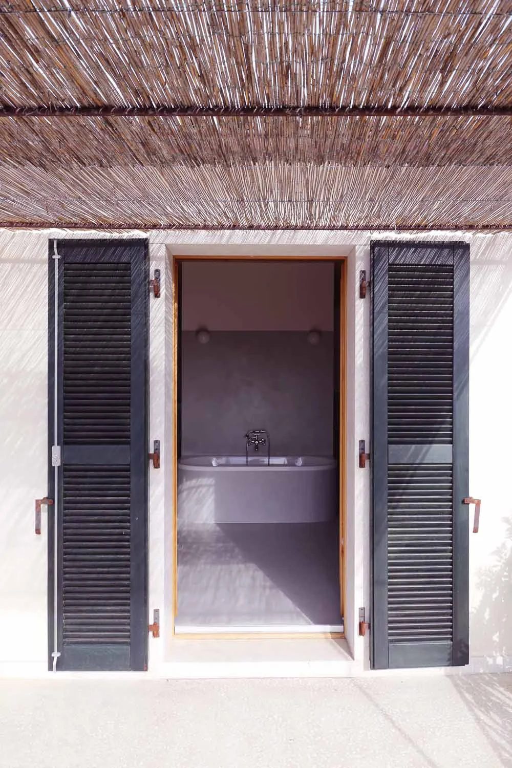 Full-length colonnaded terrace at golden hour