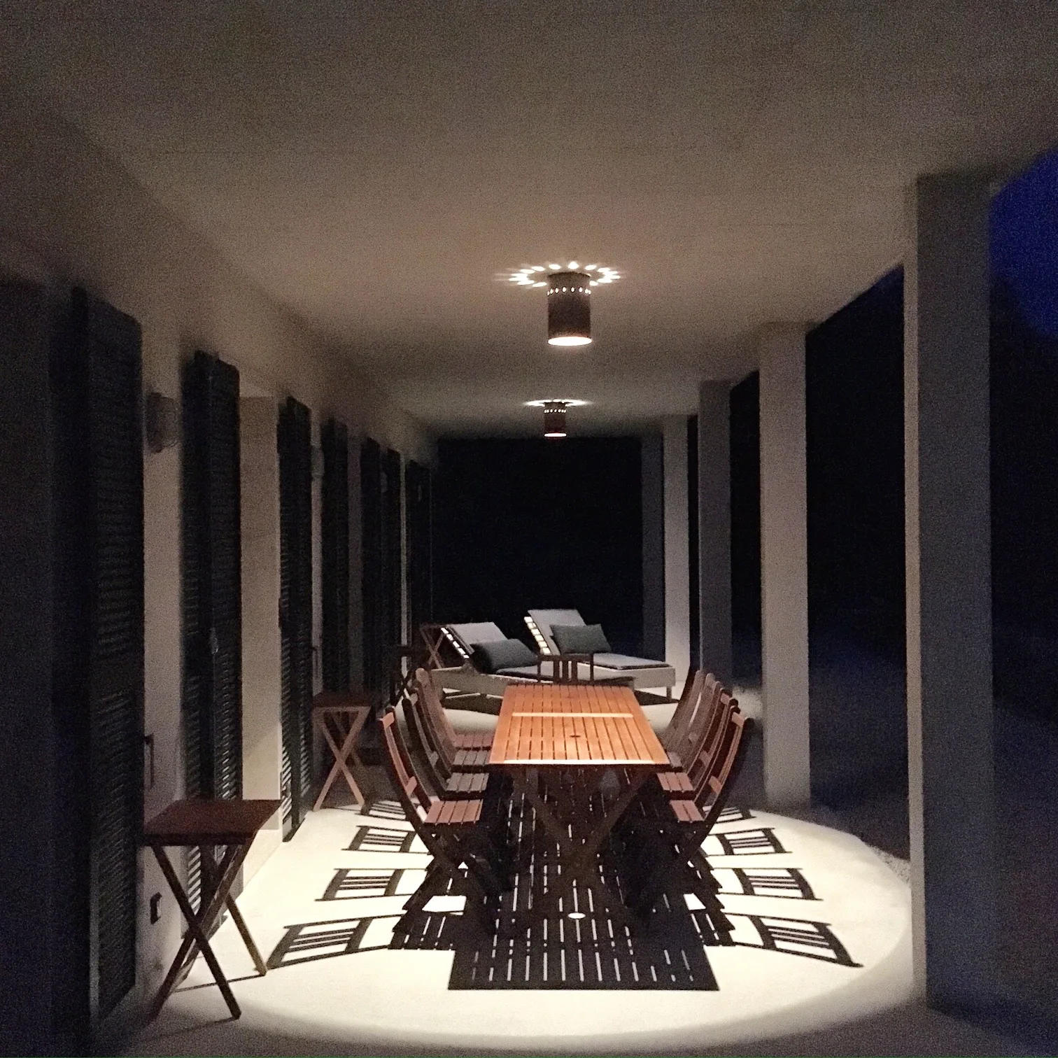 Terrace table lit at night under the stars
