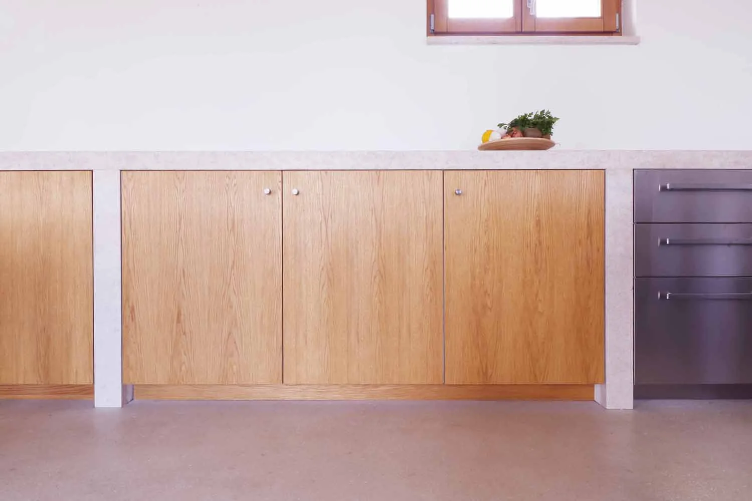 Bespoke oak kitchen cabinetry and stone countertop