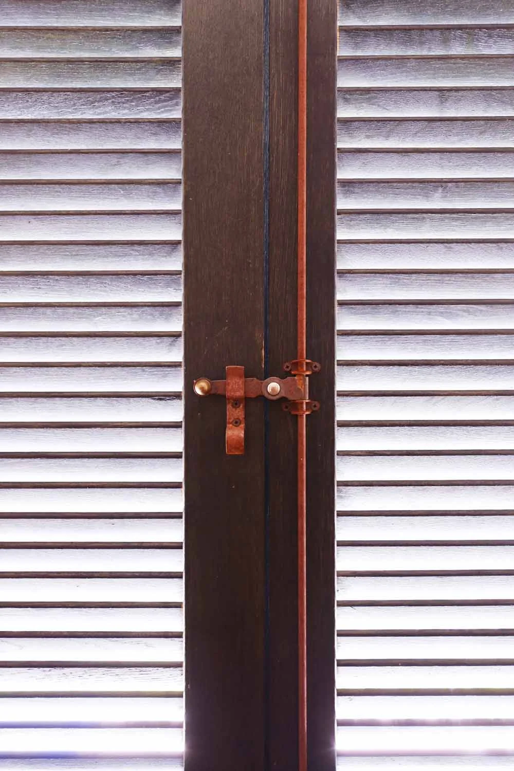 Open kitchen with island and floor-to-ceiling garden windows